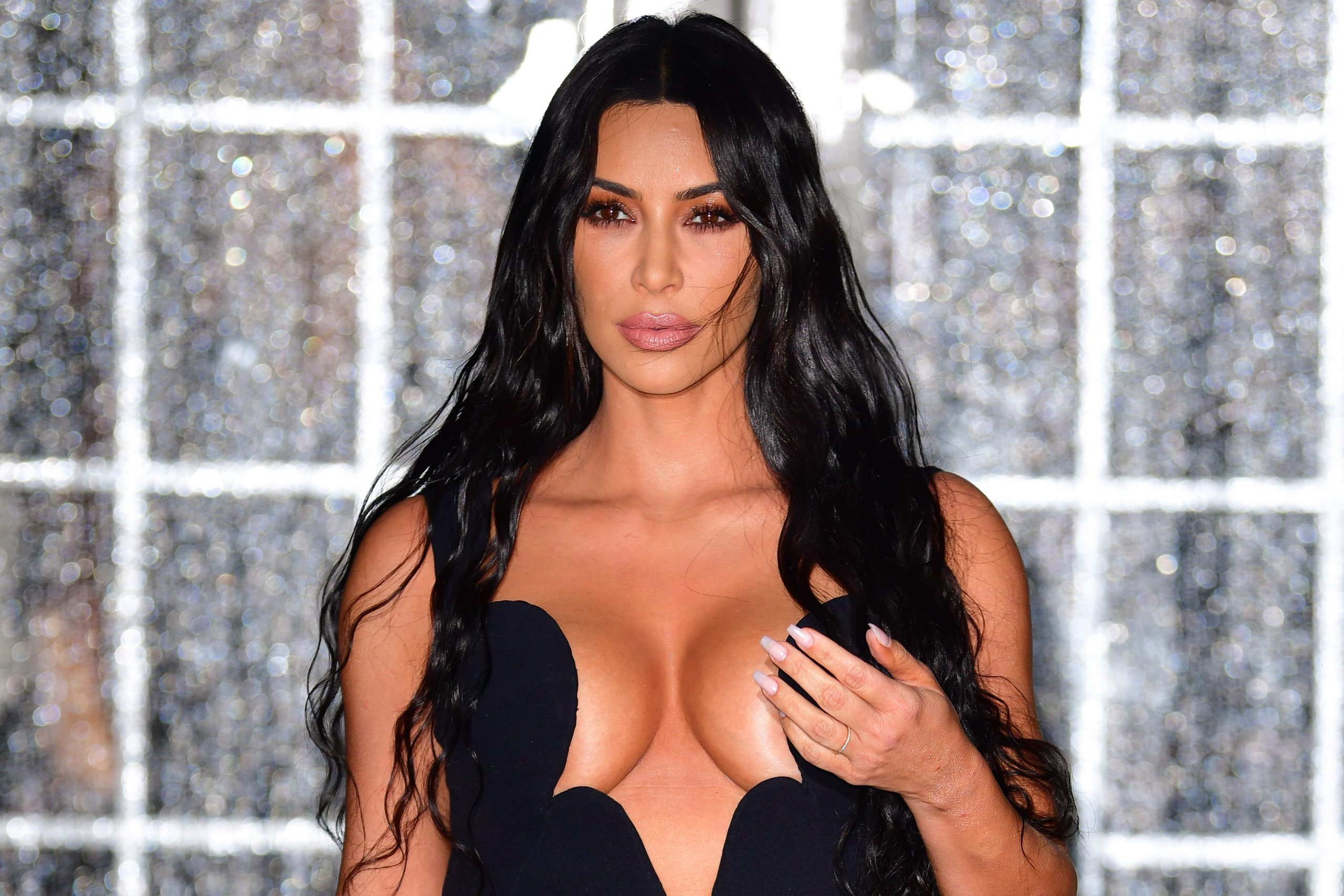 A new report claims that Kim Kardashian's bra size has already grown four cup sizes during her pregnancy. And she's only four months along!